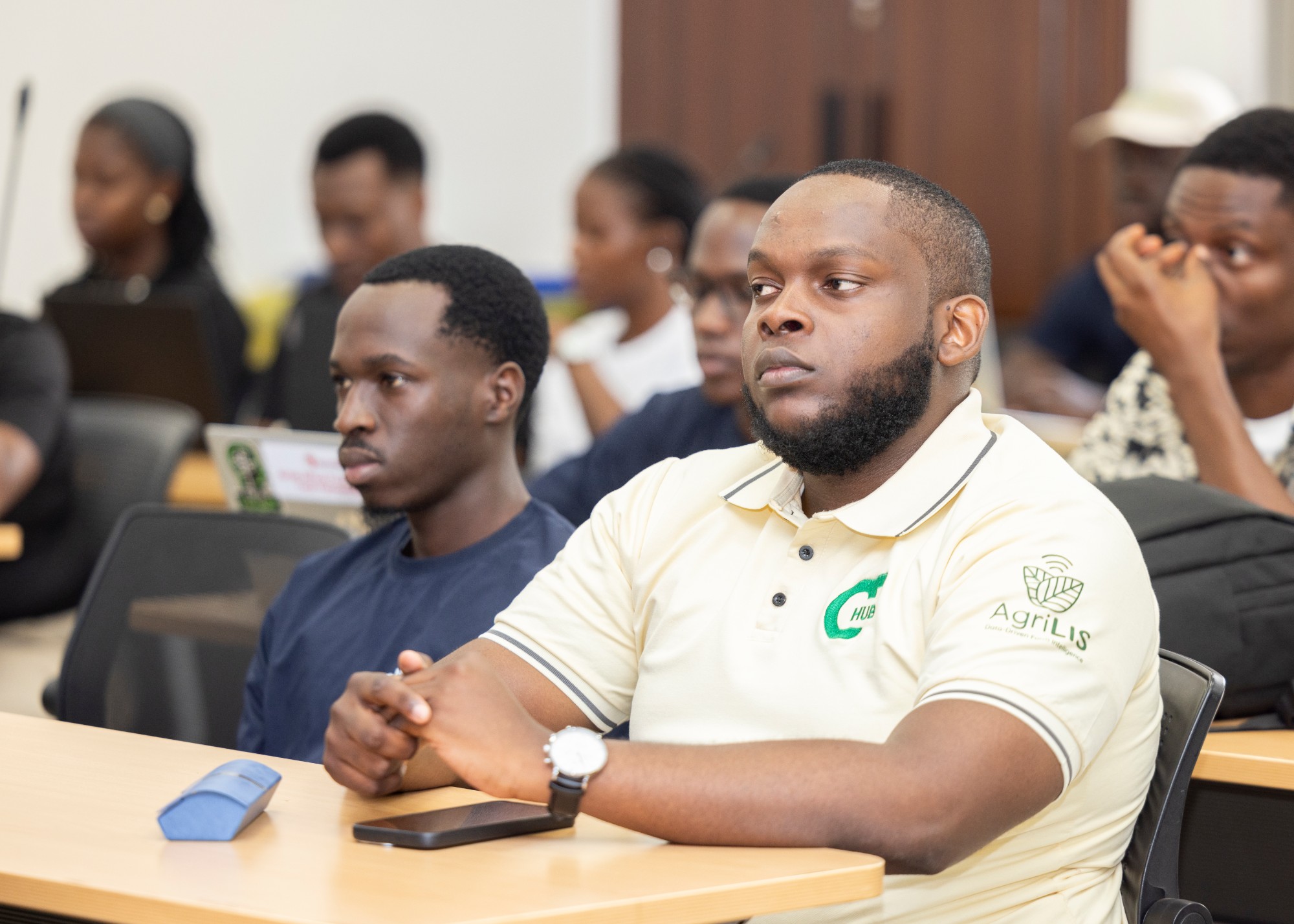 Students listening during a session, laptops open