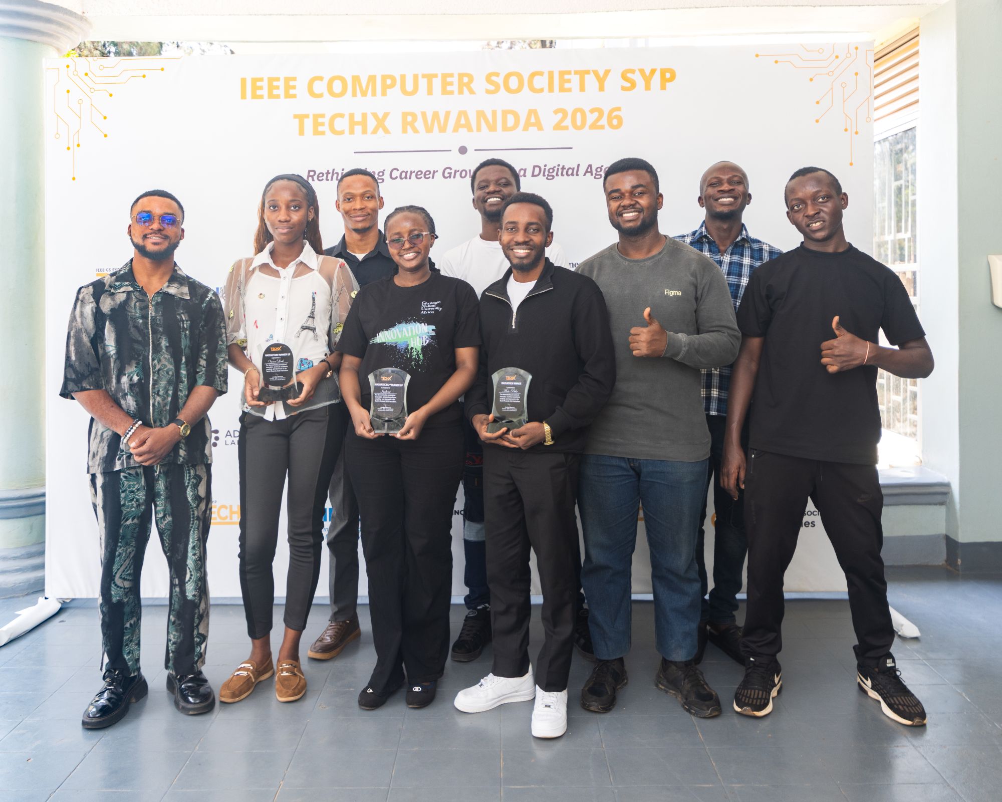 TechX Rwanda 2026 hackathon winners holding their trophies